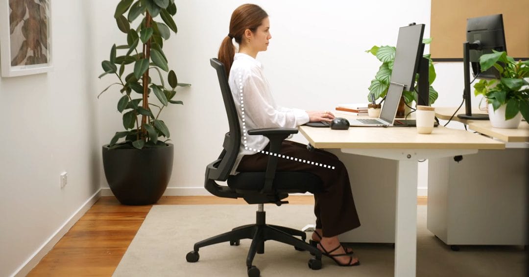 Woman in Buro Seating chair showing correct ergonomic sitting position