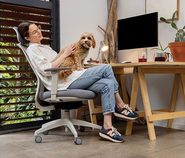 Buro Elan office chair working from home scene with lady on chair with dog