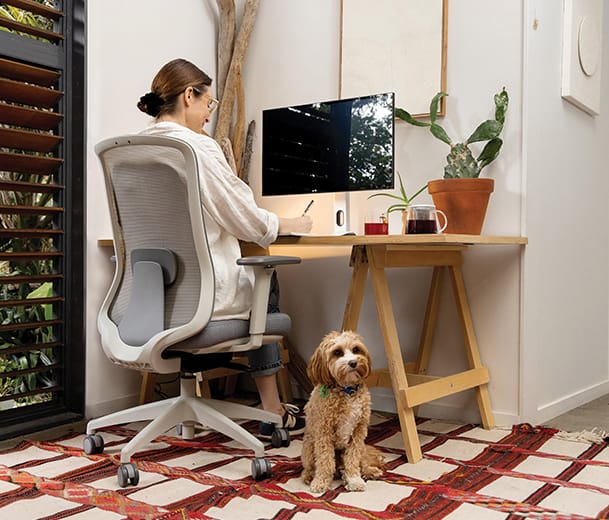 Buro Elan ergonomic chair working from home scene with lady and dog