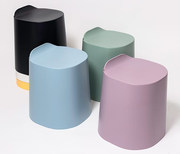 Buro Peekaboo plastic stools stacked in many colours