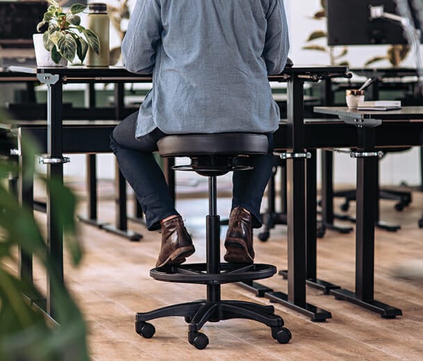 man sitting on active buro polo drafting stool