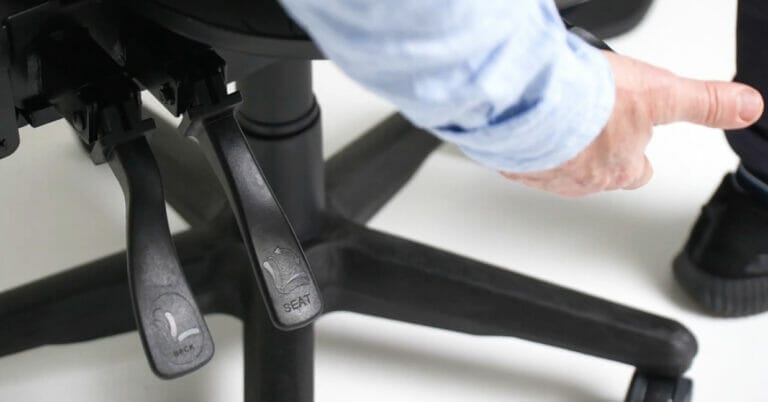 ErgoTalks man's arm adjusting a Buro ergonomic chair