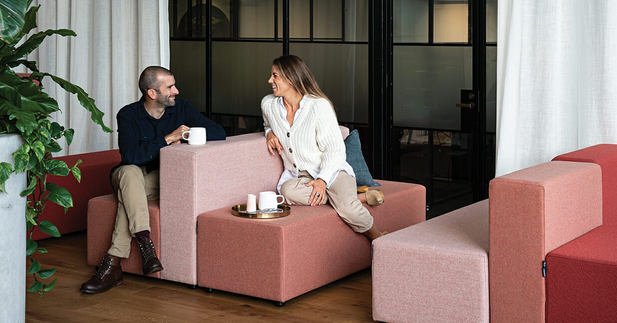 People resting in breakout area after sitting for long periods