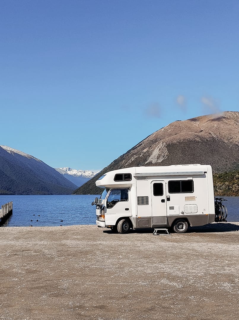 van next to lake